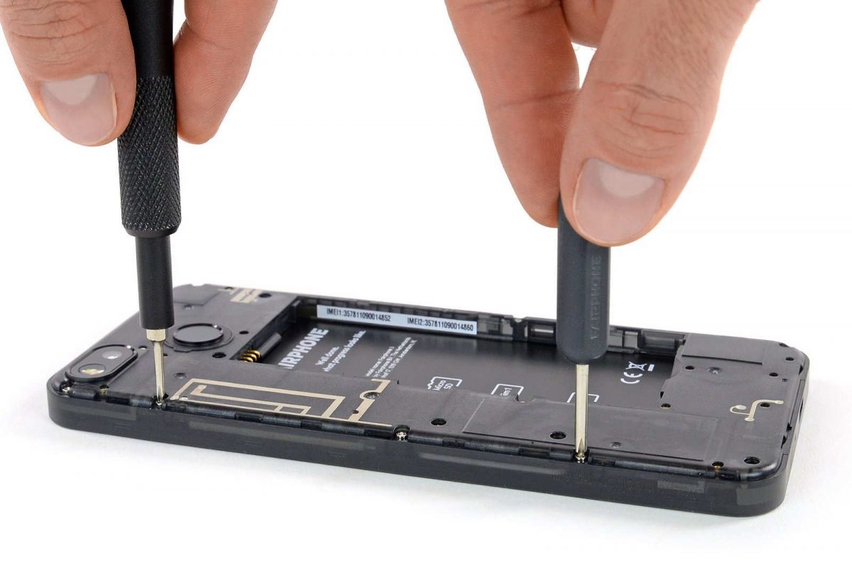 Fairphone 3 with two Phillips screwdrivers accessing them