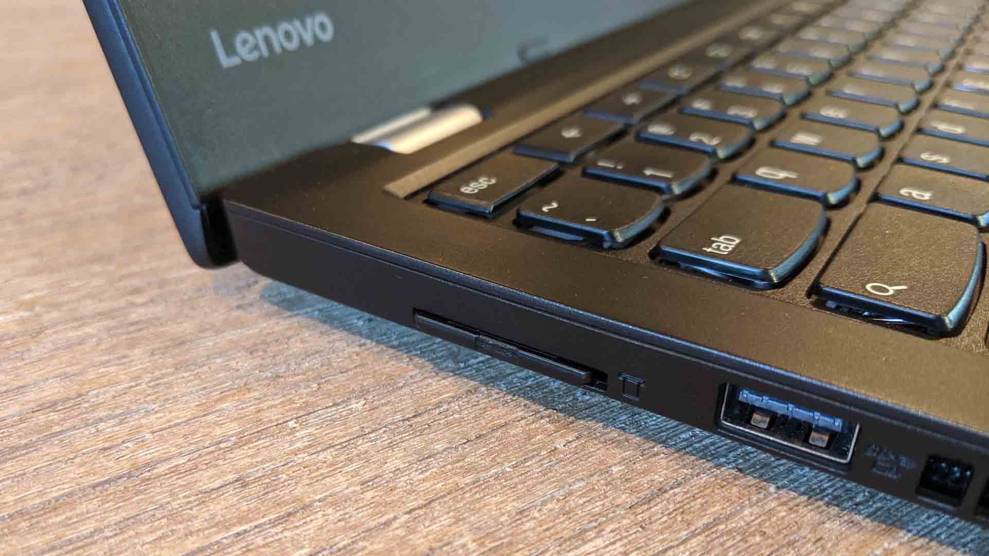 An SD card inserted into a Lenovo laptop.