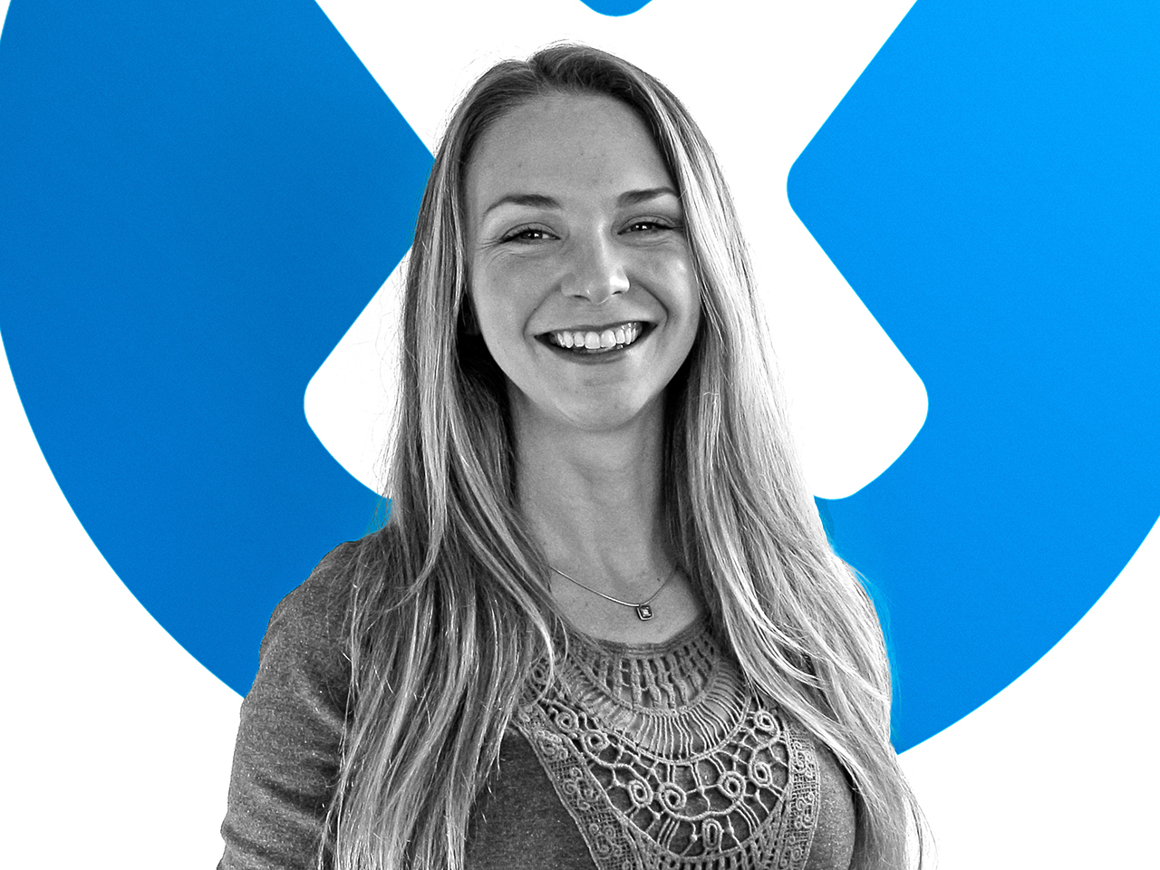 Kelsea in front of the iFixit logo