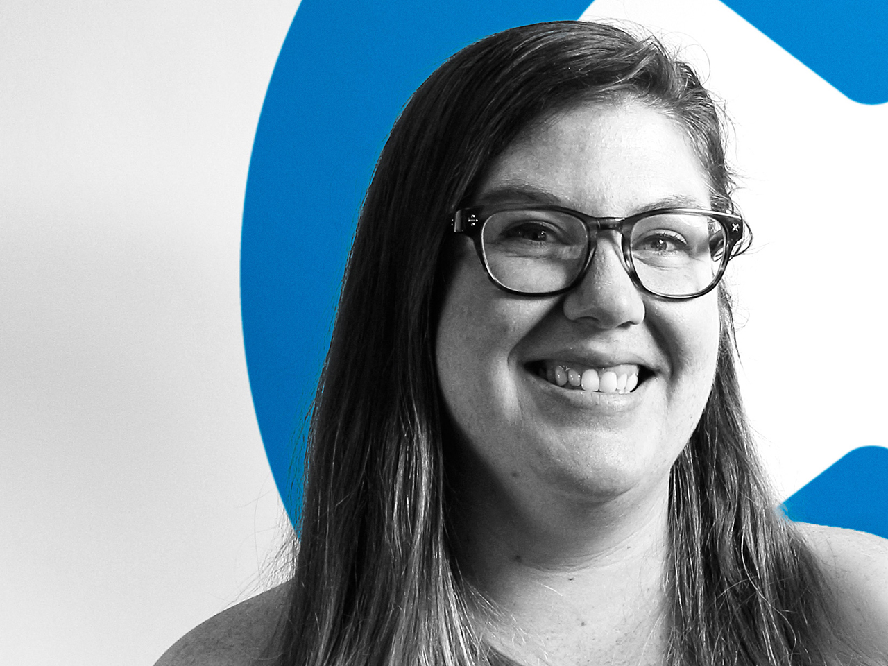 Megan in front of the iFixit logo