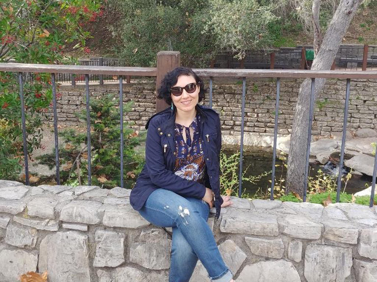 Mariana smiling in a garden