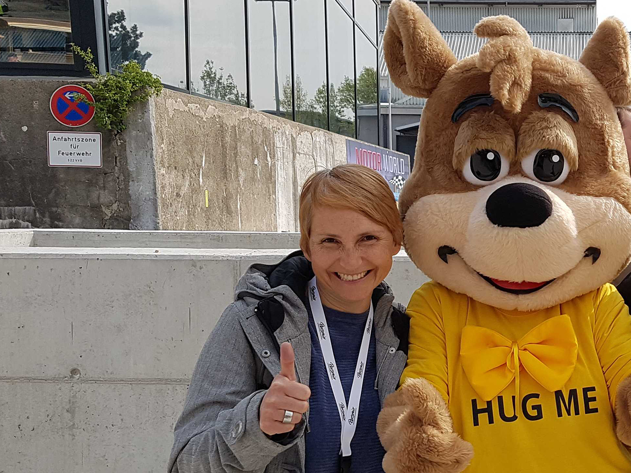 Bettina smiling with a giant bear
