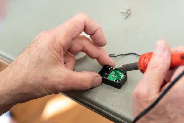 Soldering a small device during a repair cafe