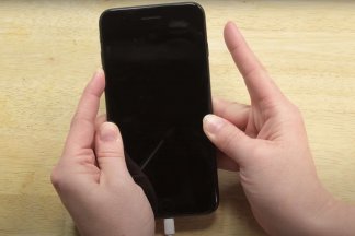 iPhone in hands, set to DFU Mode