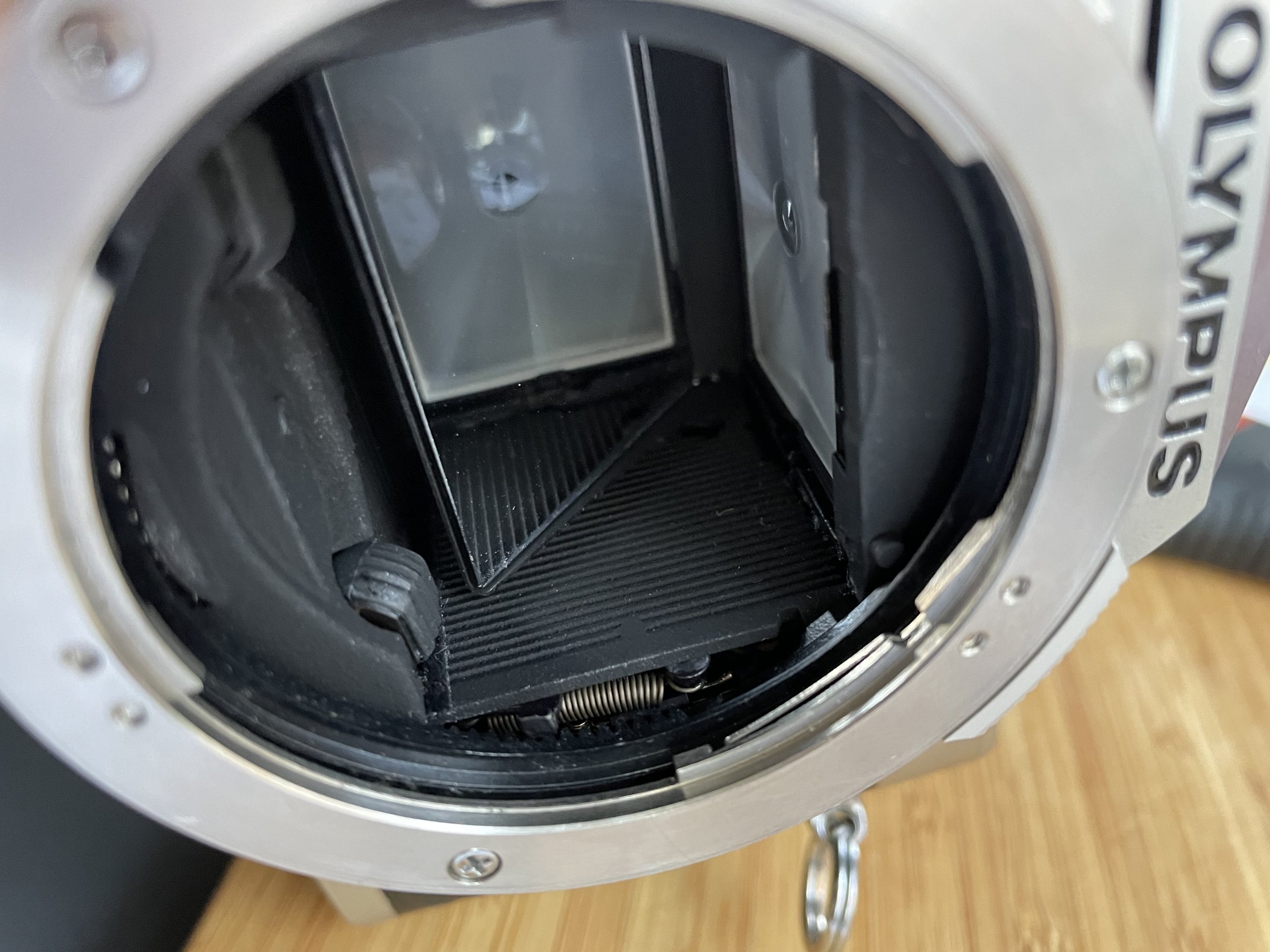 Inside the Olympus OM-2n camera's mirror mechanism.