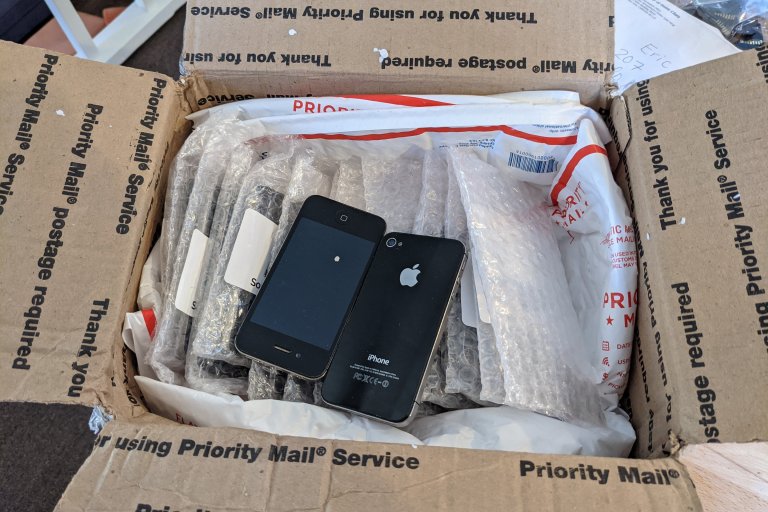 USPS box full of iPhone 4S phones