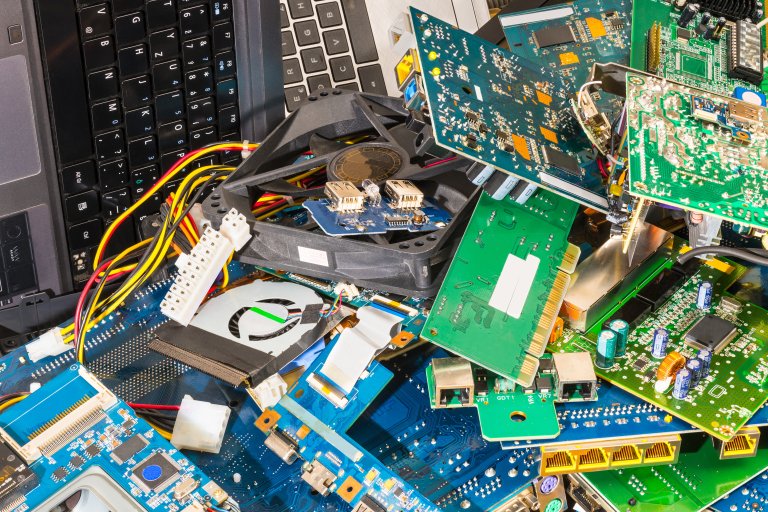 circuit boards and devices piled up as waste