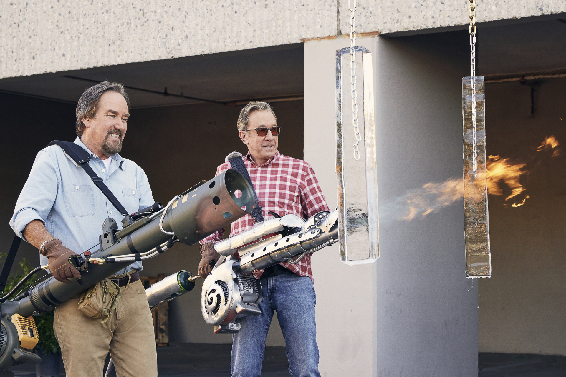 Tim Allen and Richard Karn test flamethrowers on the History show Assembly Required.