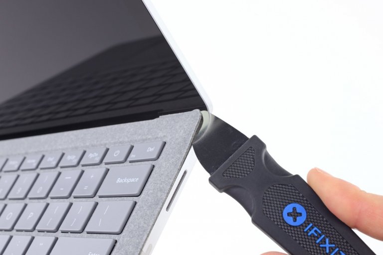 Surface Laptop being pried open with Jimmy