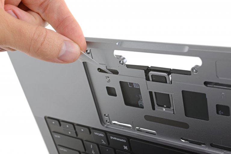 Pull tabs underneath the trackpad on the 2021 MacBook Pro