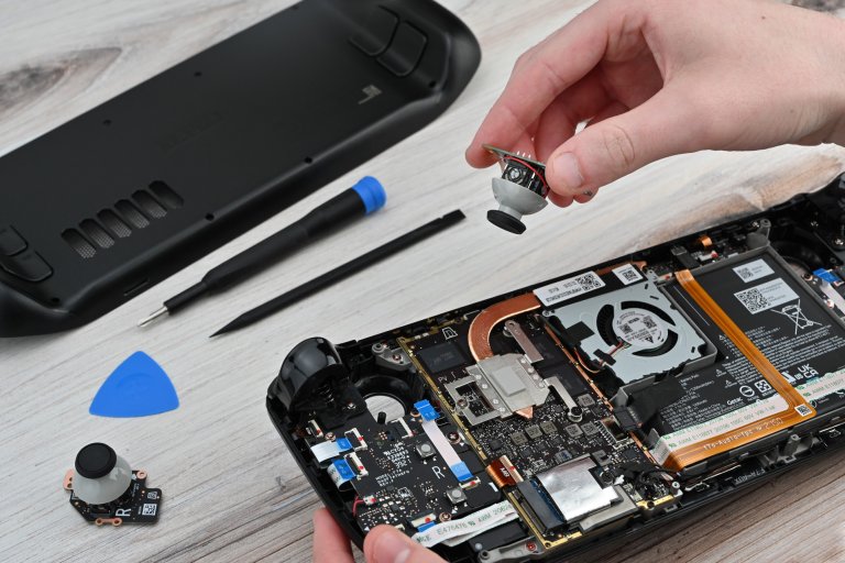Removing the thumbstick from an open Steam Deck