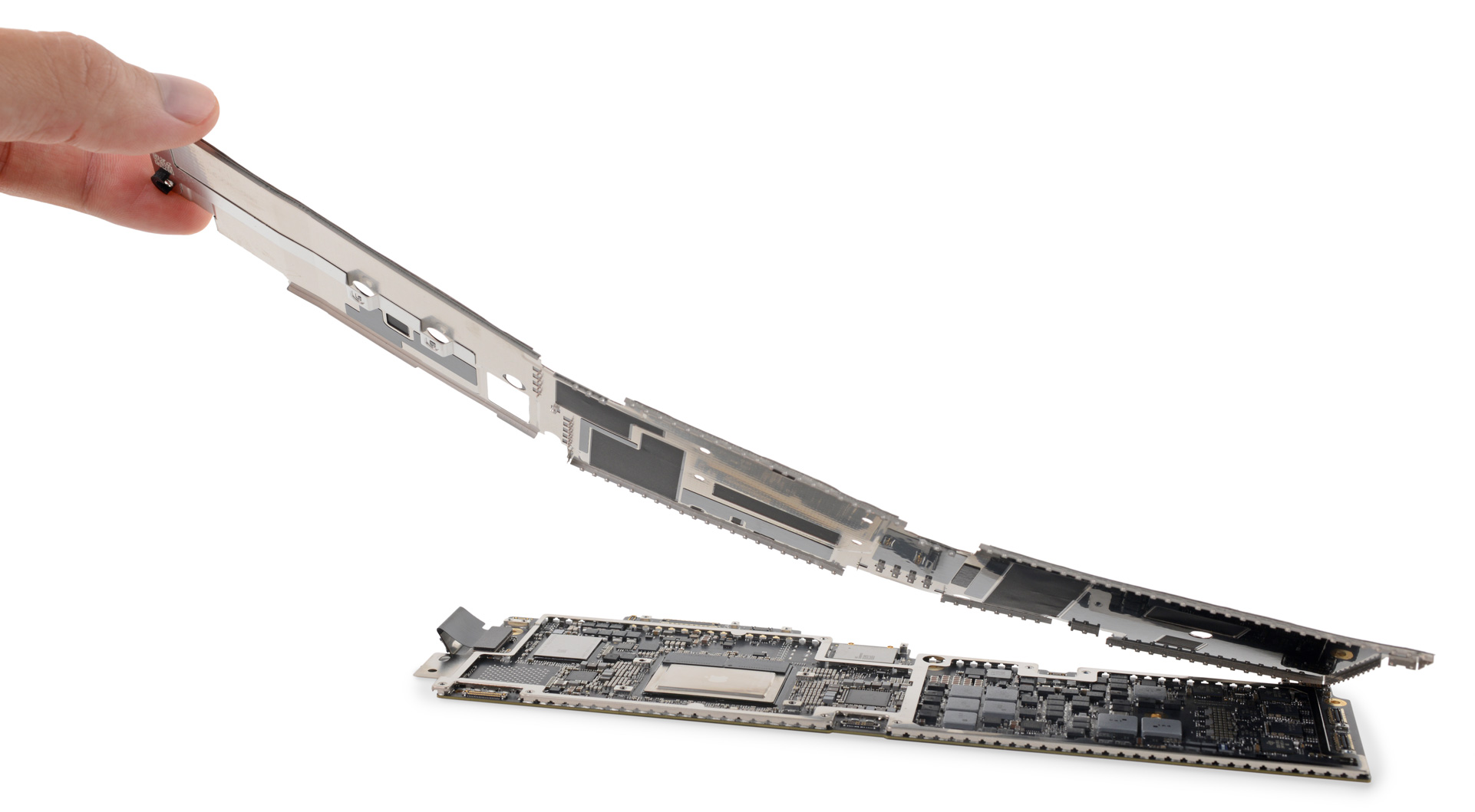 Peeling the metal shielding off of the M2 MacBook Air Logic board.