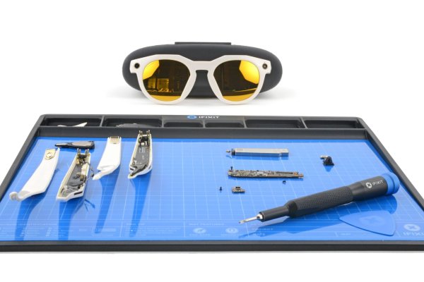 Oakley Meta smart glasses, the arms disassembled on a FixMat