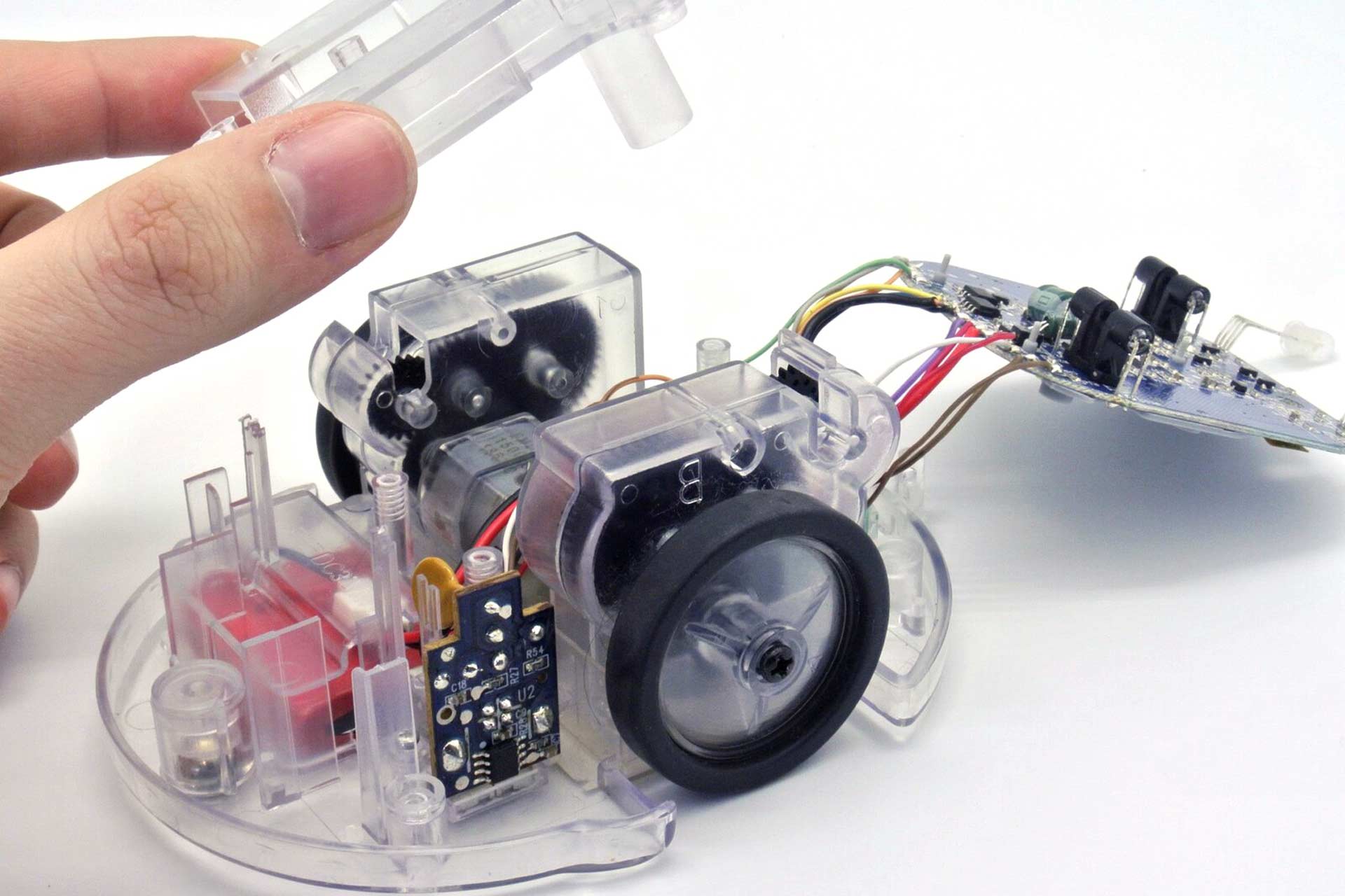 A TTS Blue-Bot coding robot is disassembled at the hands of an EPFL robotics student.