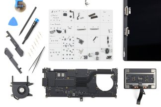 The M5 MacBook Pro battery replacement procedure, laid out on the table