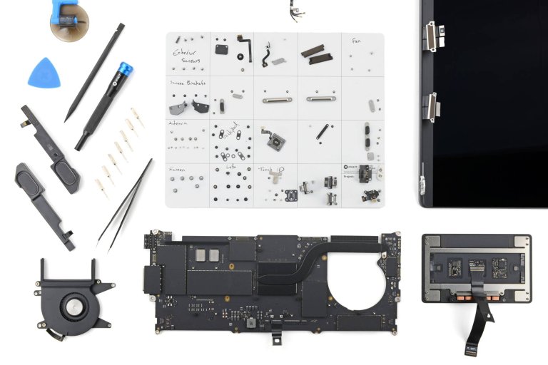 The M5 MacBook Pro battery replacement procedure, laid out on the table